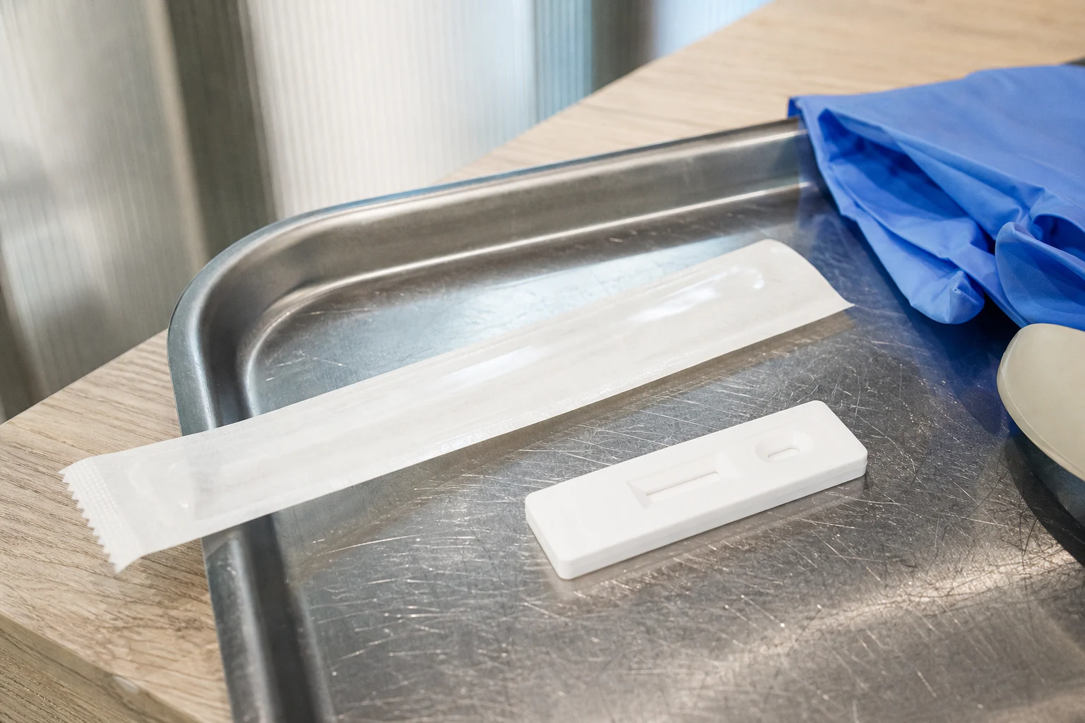Editorial still life of an unused generic rapid test and sealed swab